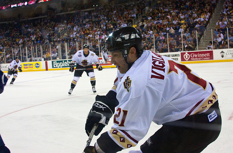 English:  A shot from the stands of a Gwinnett Gladiators vs. Pensacola Ice Pilots game in 2007. Mike Vigilante (#21)