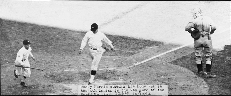 Bucky Harris of the Washington Nationals scoring his home run in the fourth inning of Game 7 (October 10) of the 1924 World Series. At right is New York Giants catcher Hank Gowdy.