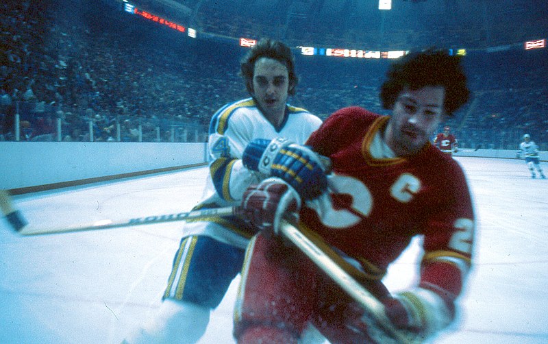 English:   Brad Marsh competing for the Calgary Flames in a game at The Checkerdome in St. Louis on November 29, 1980