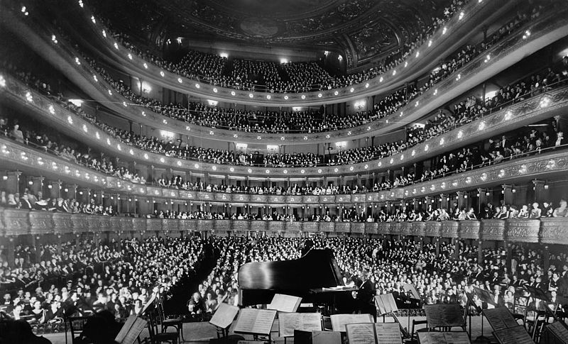 English:   The former Metropolitan Opera House (39th St) in New York City.  A full house, seen from the rear of the stage, at the Metropolitan Opera House for a concert by pianist Josef Hofmann, November 28, 1937.